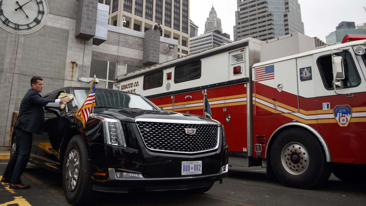 A Secret Service agent cleans the new presidential limo. Picture: AP