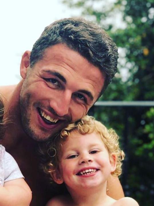 Sam Burgess with his daughter Poppy.