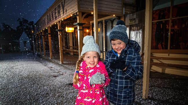 Darcy, 7, and Georgia, 5, keep warm at the Winter Wonderlights at Sovereign Hill in Ballarat, which has become a tourism hot spot. Picture: Mark Stewart