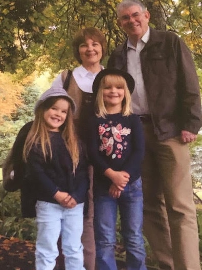 Brian Powyer and his wife Lorenza with granddaughters Olivia and Elodie.