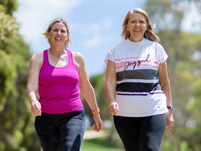 HOLD FOR JANUARY 2023Cathy Lewis (pink top) and Sally Luscombe walk together along the Maribyrnong River in Melbourne's west most weeks to try and keep the menopausal monster of weight gain at bay. Picture: Jason Edwards