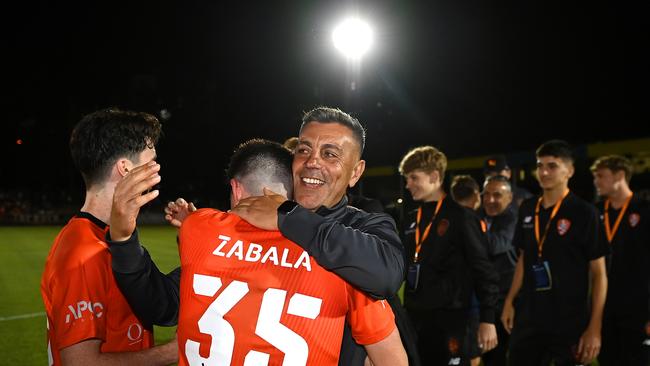 Coach Ross Aloisi embraces Roar utility Louis Zabala during Brisbane’s journey to the Australia Cup final. Picture: Albert Perez/Getty Images