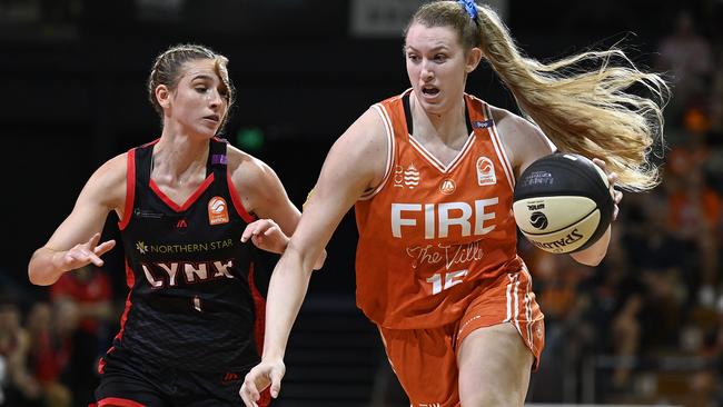 TOWNSVILLE, AUSTRALIA – FEBRUARY 26: Lauren Cox of the Fire drives to the basket past Miela Sowah of the Lynx during game two of the WNBL Semi Final series between Townsville Fire and Perth Lynx at Townsville Entertainment Centre, on February 26, 2025, in Townsville, Australia. (Photo by Ian Hitchcock/Getty Images)