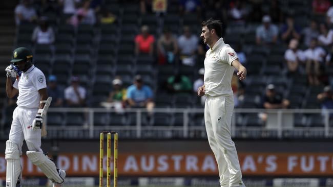 Pat Cummins reacts after dismissing South Africa's batsman Keshav Maharaj.