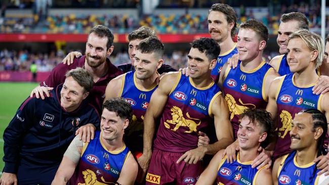 Lions players are all smiles after their QClash win. Picture: Russell Freeman/AFL Photos via Getty Images)