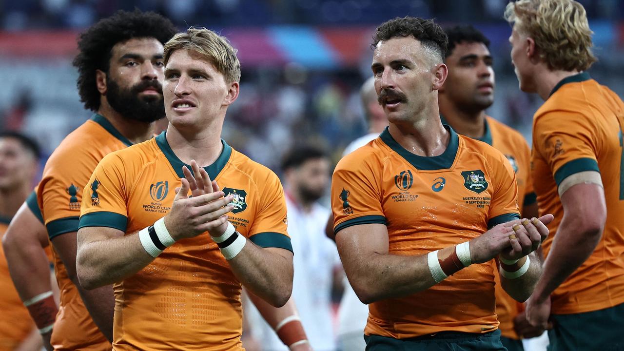 TOPSHOT - Australia's scrum-half Tate McDermott (L) and Australia's scrum-half Nic White celebrate after winning the France 2023 Rugby World Cup Pool C match between Australia and Georgia at Stade de France in Saint-Denis, on the outskirts of Paris, on September 9, 2023. (Photo by Anne-Christine POUJOULAT / AFP)