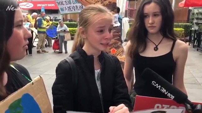 Teenager breaks down crying at climate protest