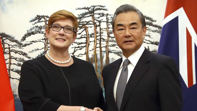 Australian Foreign Minister Marise Payne, left, and Chinese Foreign Minister Wang Yi shake hands at the end of a joint press conference at the Diaoyutai State Guesthouse in Beijing, Thursday, Nov. 8, 2018. The foreign ministers of China and Australia are meeting in what is being seen as a sign of a thaw in the recently frosty relationship between the key economic partners. (AP Photo/Mark Schiefelbein)