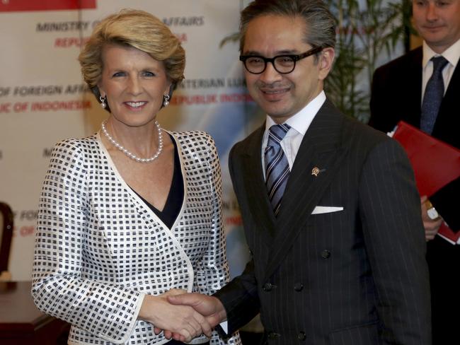 Australian Foreign Minister Julie Bishop, left, is greeted by his Indonesian counterpart Marty Natalegawa prior to their meeting in Jakarta, Indonesia in 2013. Picture: Tatan Syuflana