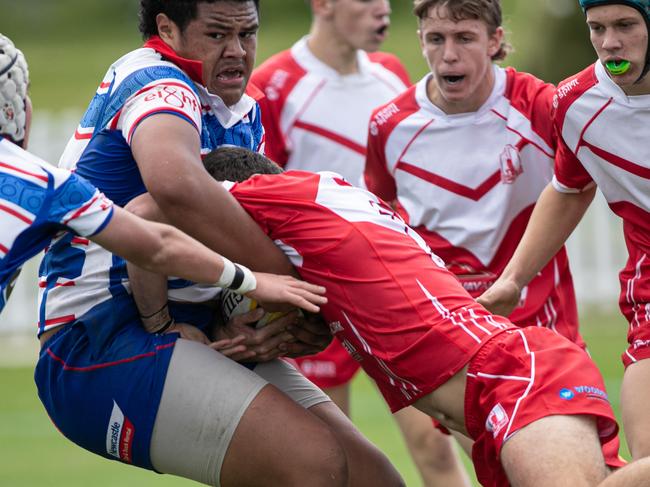 07/06/25. News Local. Sport. Merrylands, Sydney, NSW.Action pictures from the NSW Rugby Juniors 2025 State Championships  Under 16s in Merrylands.Action from the game:Hunter v Central NorthPicture shows:Central north player Jedd Smallwood tackles a much bigger opponent.Pics by Julian Andrews.