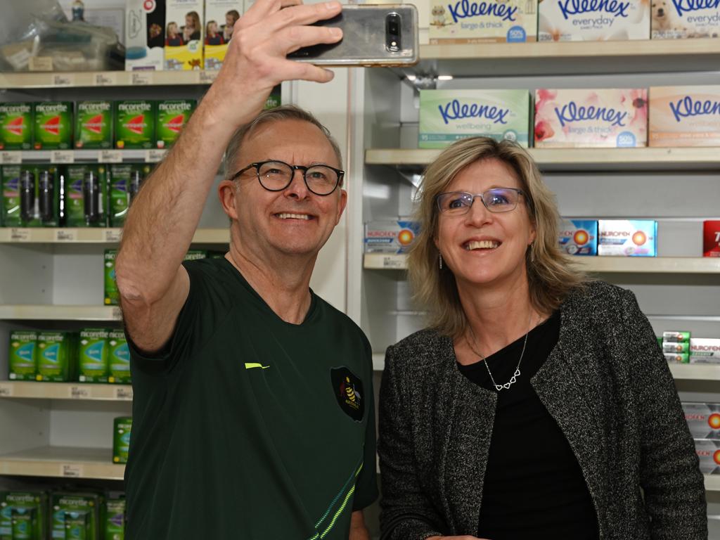 Mr Albanese poses for a selfie with a customer at the pharmacy. Picture: AAP / Dean Lewins