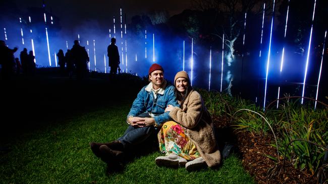 Luke and Charlotte Davey chill out at Resonate by Moment Factory in the Botanic Garden, part of Illuminate Adelaide. Picture: Matt Turner