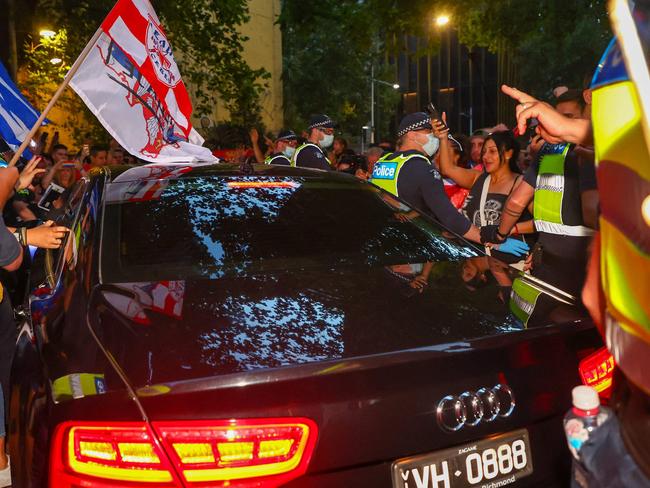 Police try to hold back supporters of Novak Djokovic as the tennis legend leaves the office of his legal team in Melbourne back in 2022. Picture: AFP