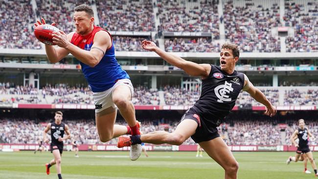 Steven May takes an acrobatic mark against Carlton’s Ed Curnow.