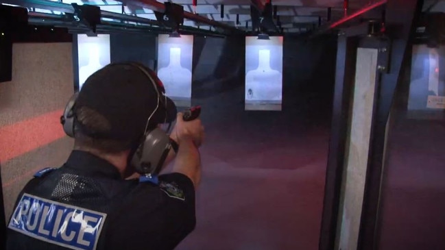 An officer using the firing range in a still from a police recruitment video from 2019. Picture: SA Police