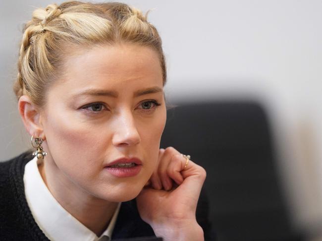 US actor Amber Heard speaks with a member of her legal team as she arrives at the Fairfax County Circuit Courthouse in Fairfax, Virginia, on May 19, 2022. Picture: Shawn Thew/ AFP.