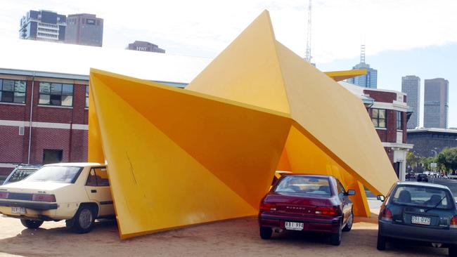 02/06/2003. Cars parked under the Yellow Peril. Digital image.