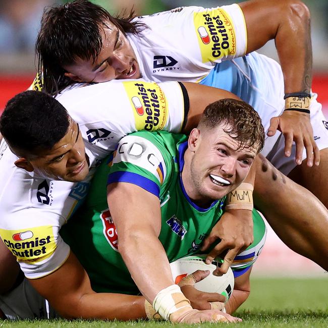 The Titans wrap up Hudson Young, with hands all over the ball. Picture: Mark Nolan/Getty Images