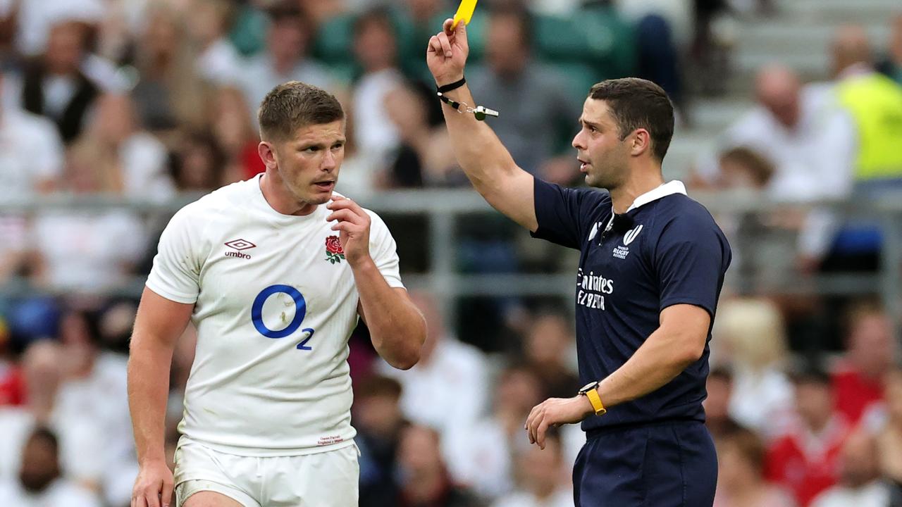 Nika Amashukeli, the referee, shows Owen Farrell, the England captain, a yellow card. Photo by David Rogers/Getty Images