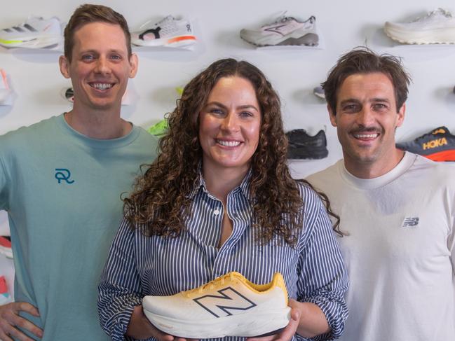 Jack Warhurst (blue t-shirt), Abby Willoughby and Josh Willoughby (white t-shirt) at the RunDNA store in Hindmarsh. Picture: Supplied by RunDNA