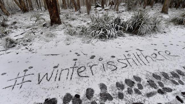 Writing in the snow at Mt Macedon. Picture: Jay Town