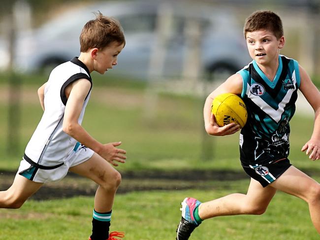 Bailey MacLeod of Laurimar in action during an under 10s practice match between Laurimar Power and St. Mary's played at Laurimar Reserve on Sunday, March 30, 2014 in Doreen, Victoria. The match trialed new rules including not keeping score.