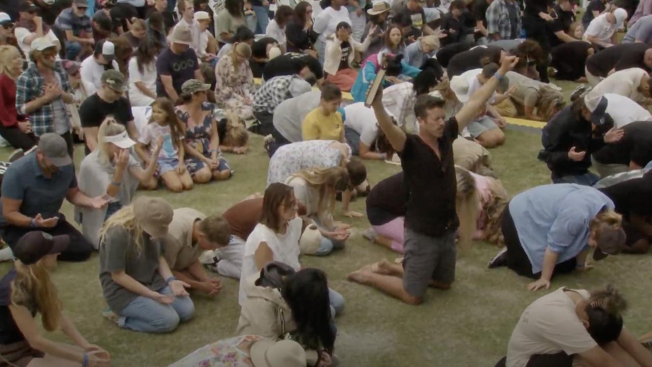 Hundreds of Christians bowing at the Awakening Australia event on Friday.