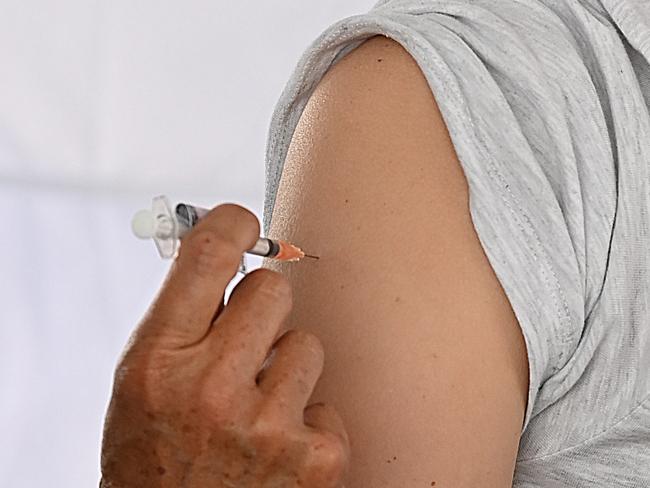 07/11/2021:  Phoebe Lock , 26 from Gordon Park (0434217456 mb do not publish number) gets her second  Covid vaccine jab at a Bunnings store pop up Covid clinic, in Stafford, Brisbane . Lyndon Mechielsen/Courier Mail