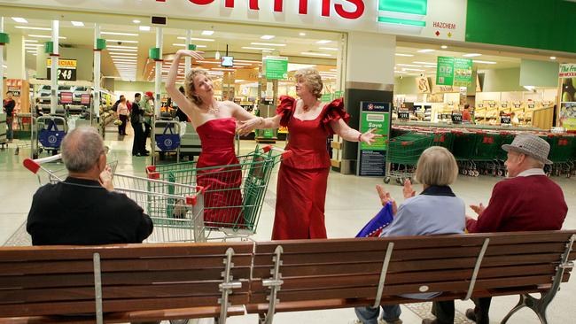 Opera Singers Liza Beamish (L) and Kathleen Procter entertain the shoppers outside Woolworths at Chermside shopping centre.