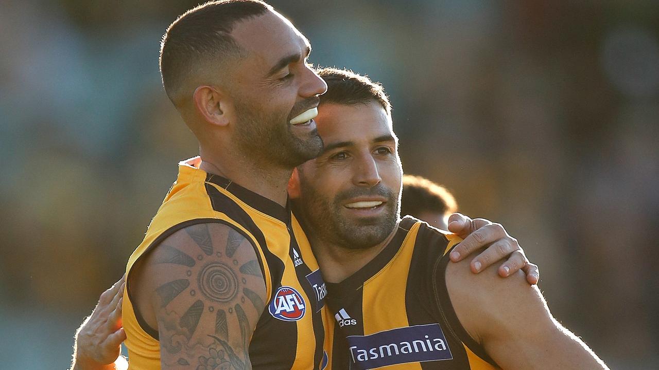 Shaun Burgoyne and Paul Puopolo celebrate after a Hawthorn win in Tassie. Picture: Getty Images