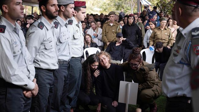 The mother of Israeli soldier Ilay Levy, centre, during his funeral at the military cemetery in Tel Aviv. Picture: AFP