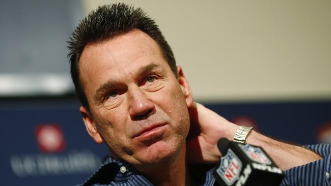 Gary Kubiak reacts at a news conference as he steps down as head coach.