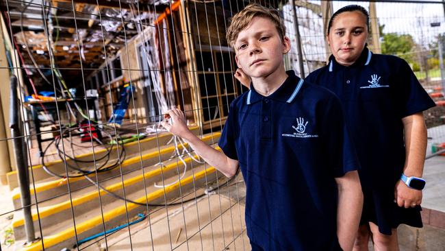 Lucas Whitelegg and Zara Frazzica in front of ongoing school refurbishment work at Mildura West Primary School Picture: Brandan McGlynn