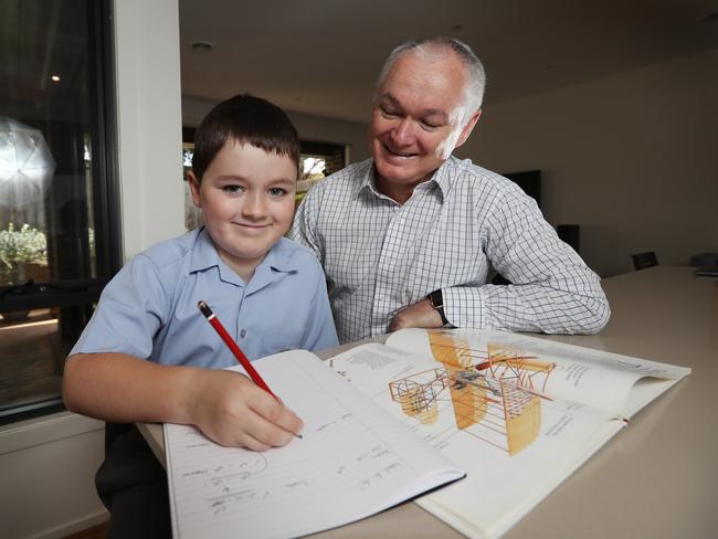 John Williams, with his son Liam, says private school fees are worth it. Picture: Alex Coppel.