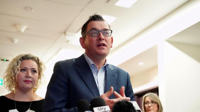 Premier Daniel Andrews (centre) and State Health Minister Jill Hennessy (left) speaks to the media during a press conference in Melbourne, Thursday, July 18, 2018. The state government is planning on improving nurse to patient ratios. (AAP Image/Alex Murray) NO ARCHIVING