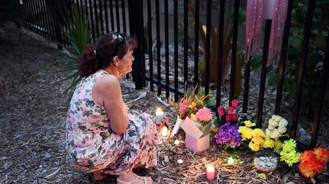 Cheryl Lee Francis lights a candle at a vigil for her daughter, Shae outside The Hub on Torquay earlier this year. Photo: File / Cody Fox.