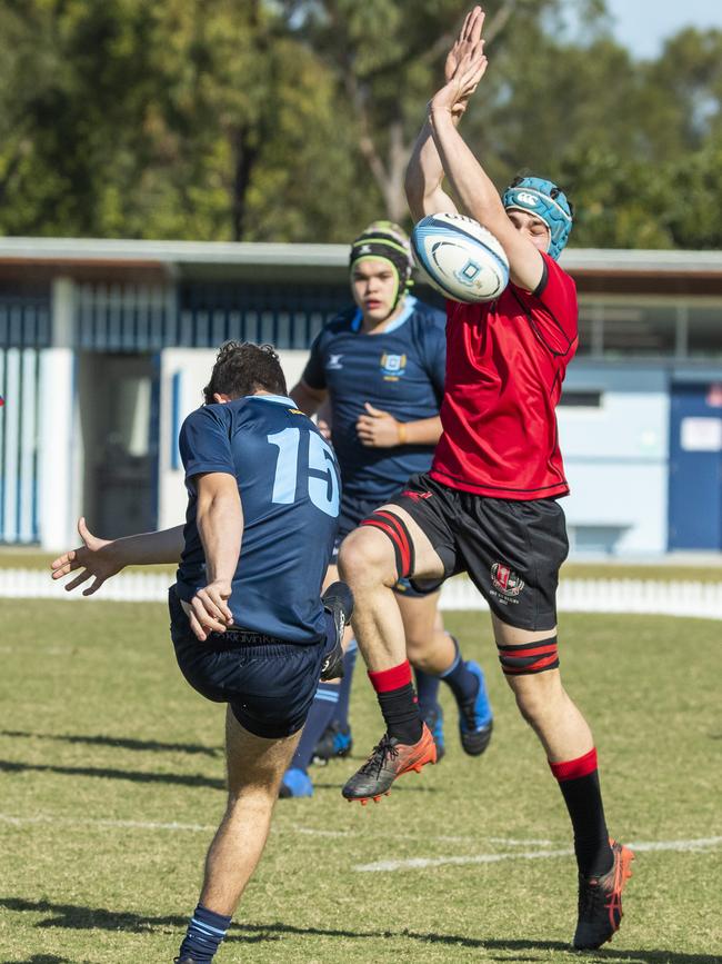 Ben Mooney has his kick smothered in the GPS 1st XV Rugby game between Brisbane Grammar and Gregory Terrace at Northgate, Saturday, July 30, 2022 - Picture: Richard Walker