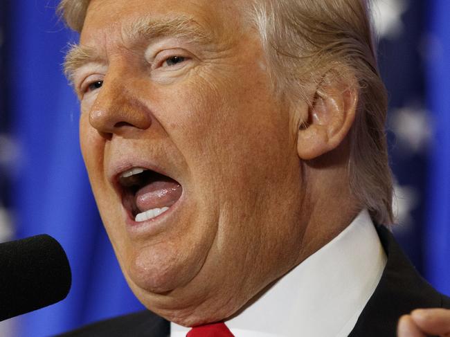 FILE - In this Jan. 11, 2017 file photo, President-elect Donald Trump speaks during a news conference in the lobby of Trump Tower in New York. Trump has promised to donate to the Treasury "profits" from foreign governments officials staying at his hotels. But he left unawares many questions about the practicalities, pitfalls and accountability. (AP Photo/Evan Vucci, File)