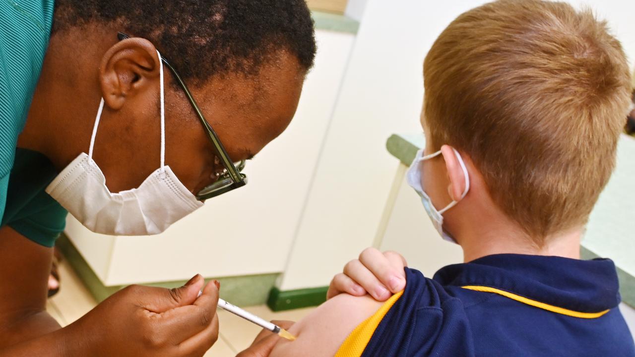 Dr Faith Ndiso gives the Covid vaccine to 12 year old Billy Brautigam. Picture: Julianne Osborne