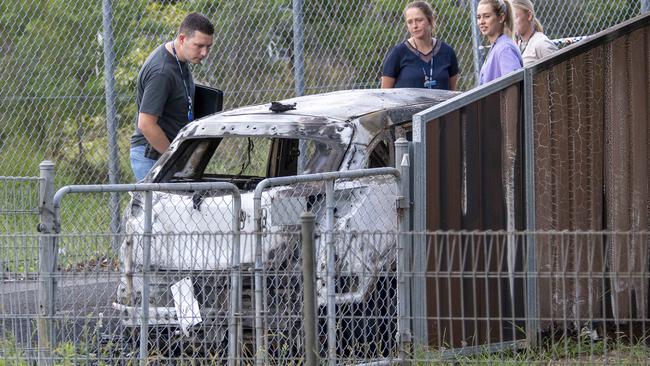 The suspected getaway car lies burnt out at Birrong train station. Picture: NCA NewsWire