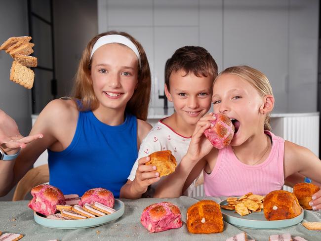 New Hot Cross Bun flavours., Ella 11 (blue top), Ava 9 (pink top), Tommy 5, Grandma Deb 71.Picture Rebecca Michael.