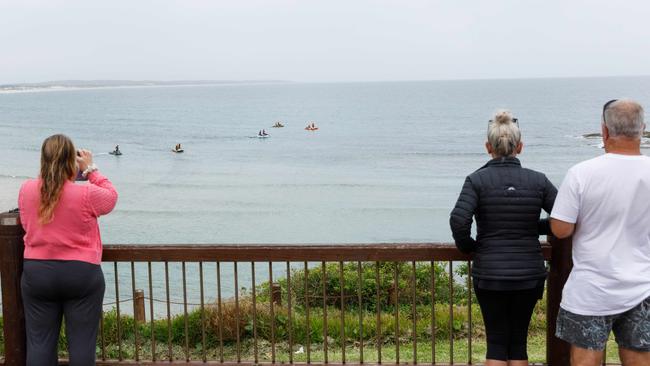 People watch on as the search for a missing boy continued. Picture: Max Mason-Hubers