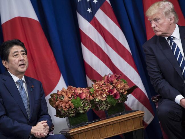 Japan's Prime Minister Shinzo Abe makes a statement for the press while US President Donald Trump listens. Picture: AFP