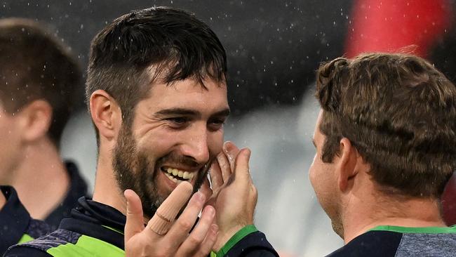 Ireland's Captain Andrew Balbirnie (L) celebrates their win over England.