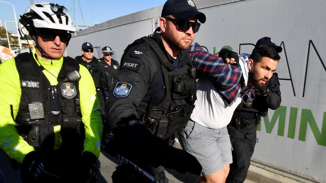 Police arrest an Extinction Rebellion protester. Picture: AAP.