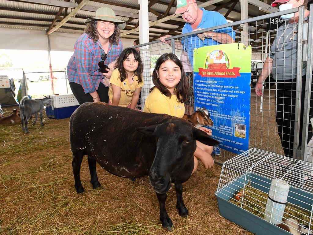 Lismore Mum, Katie Coughlan with her daughters Saktika and Gloria at the Lismore Show petting some very tame goats, chooks, geese, and ducks. Picture: Cath Piltz