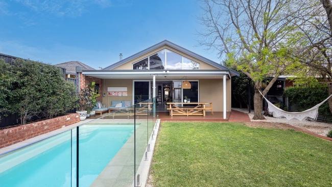 The rear lawn with swimming pool.