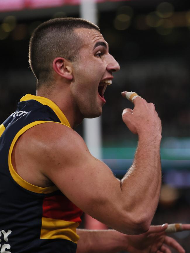 Crow Josh Rachele taunts Port Adelaide fans. Picture: James Elsby/AFL Photos via Getty Images