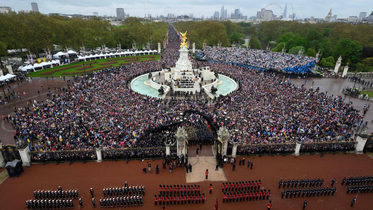 Crowds gather outside Buckingham Palace to view the royal family’s balcony appearance. Picture: AFP