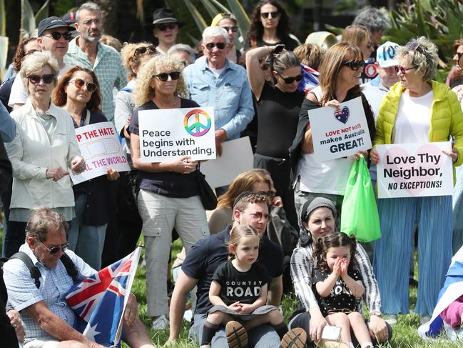 Placards calling for ‘unity’ and ‘peace’ were displayed at the vigil. Picture: David Crosling